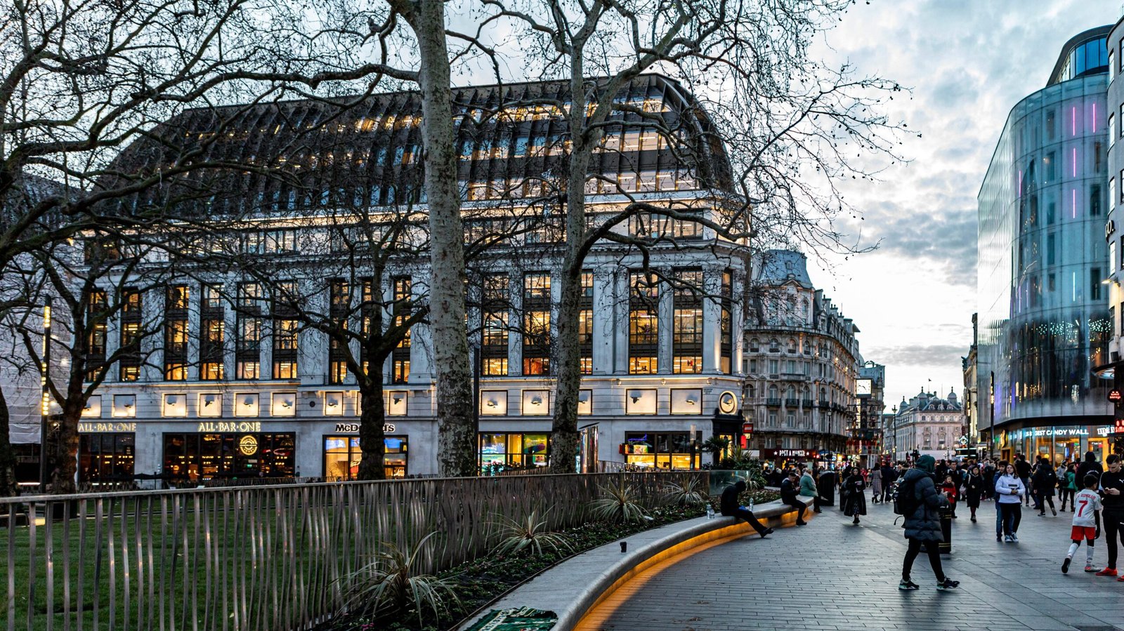 View of Leicester Square during rainy sunset.