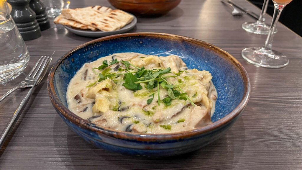 Quarter House Restaurant Aberdeen | Krista the Explorer Creamy pasta with mushrooms and greens in a blue ceramic bowl.