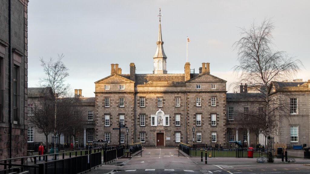 Architecture Aberdeen | Krista the Explorer Front view of a historic stone campus building with a tall central spire.