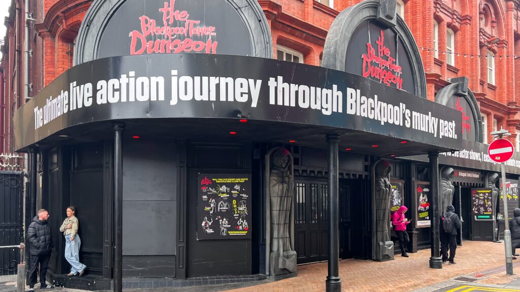 The Blackpool Tower Dungeon | Krista the Explorer Exterior view of The Blackpool Tower Dungeon with black and red sign.