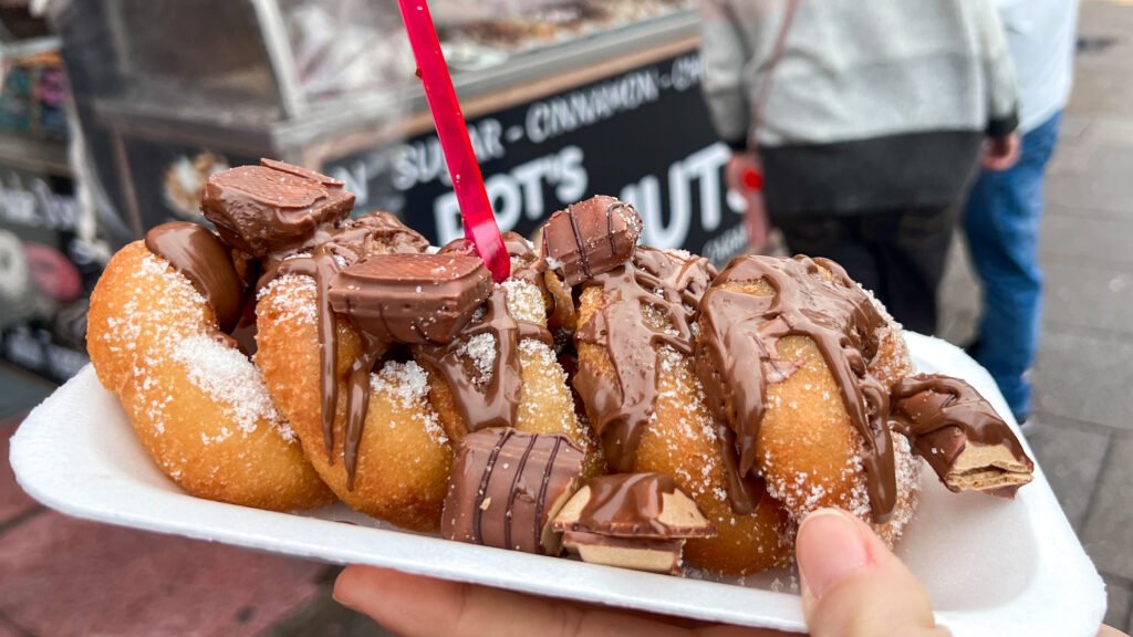 Doughnuts Blackpool | Krista the Explorer Doughnuts covered in chocolate and sugar, arranged on a white tray.