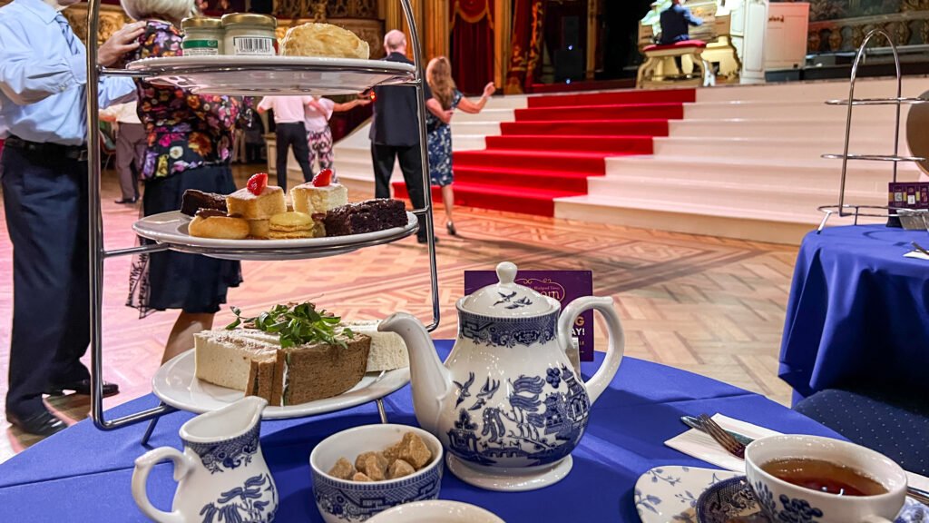 Blackpool Tower Ballroom | Krista the Explorer Afternoon tea inside ballroom with dancers in background.
