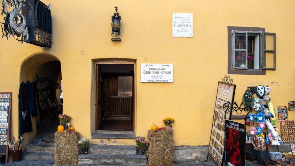 Entrance to Vlad Dracula's house painted in pale yellow.