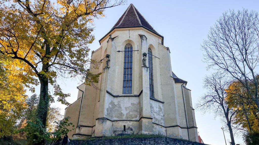 Old church in Romanian town sitting on hilltop.