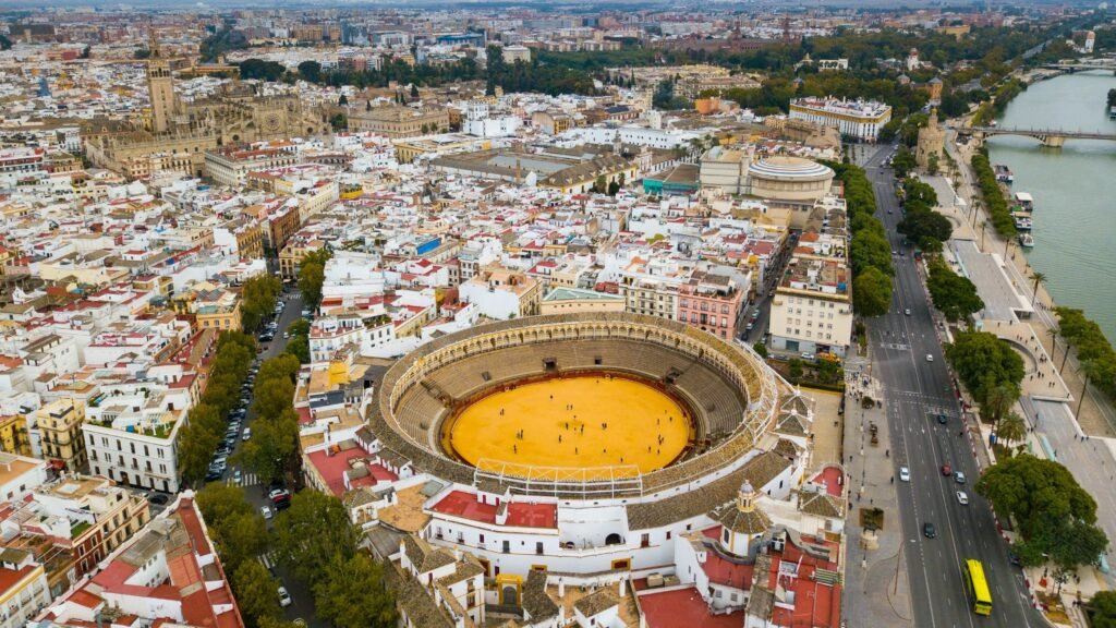 Aerial view of Seville with the Maestranza bullring in the foreground.